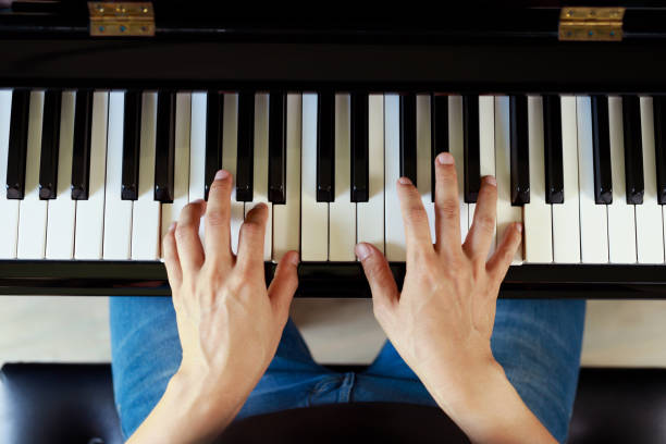 istock Musician playing piano performing at concert stage 1467191363