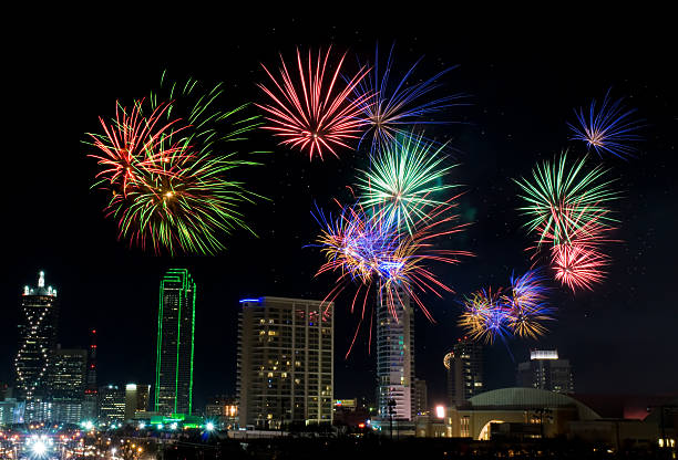 Fireworks in Dallas Texas Colorful fireworks display in Dallas, Texas celebrating New Years Eve. Business district and office buildings in background. reunion tower photos stock pictures, royalty-free photos & images