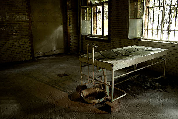 Decayed Anatomy Laboratory A view on the old autopsy table inside the decayed Beelitz Sanatorium, Germany. Built around 1900 to cure tuberculosis, used by the soviets after WWII, the complex is rotting and decaying nowadays. The complex is also a beloved scenery for photographers and even some filmcrews are using the buildings. For example, parts Tom Cruise's "Valkyrie" have been filmed there. brandenburg state photos stock pictures, royalty-free photos & images