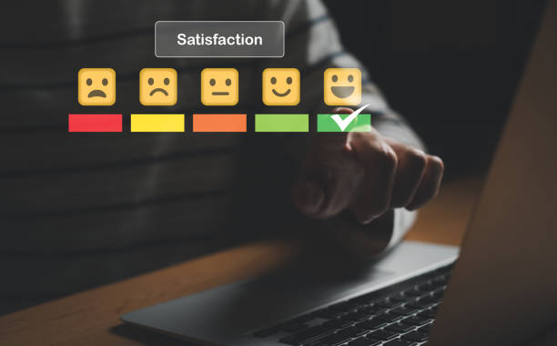 istock Selective focus at finger of business man while point finger to choose feedback on excellent customer service with five star score with smile. Service evaluation concept with futuristic icon. 1467203842