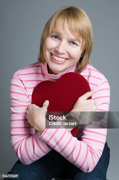 This Is The Greatest Gift Stock Photo - Download Image Now - Hugging Self, Mature Women, One Woman Only