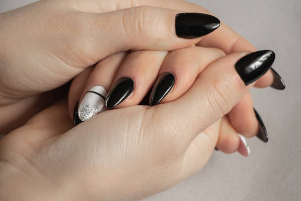 istock extended nails with black and white manicure on a gray background, manicure 1467218273