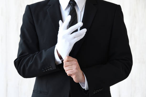 homme d’affaires portant un gant blanc - formal glove photos et images de collection