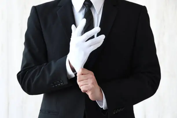 Business person wearing white glove