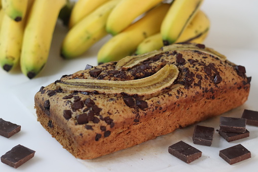Chocolate banana bread loaf. Whole wheat chocolate banana bread with coconut oil. No maida, no butter bread. A quick cake preparation. Shot on white background.