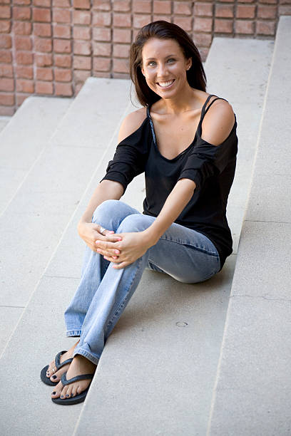 istock Woman Sitting on Concrete Stairs 146722045