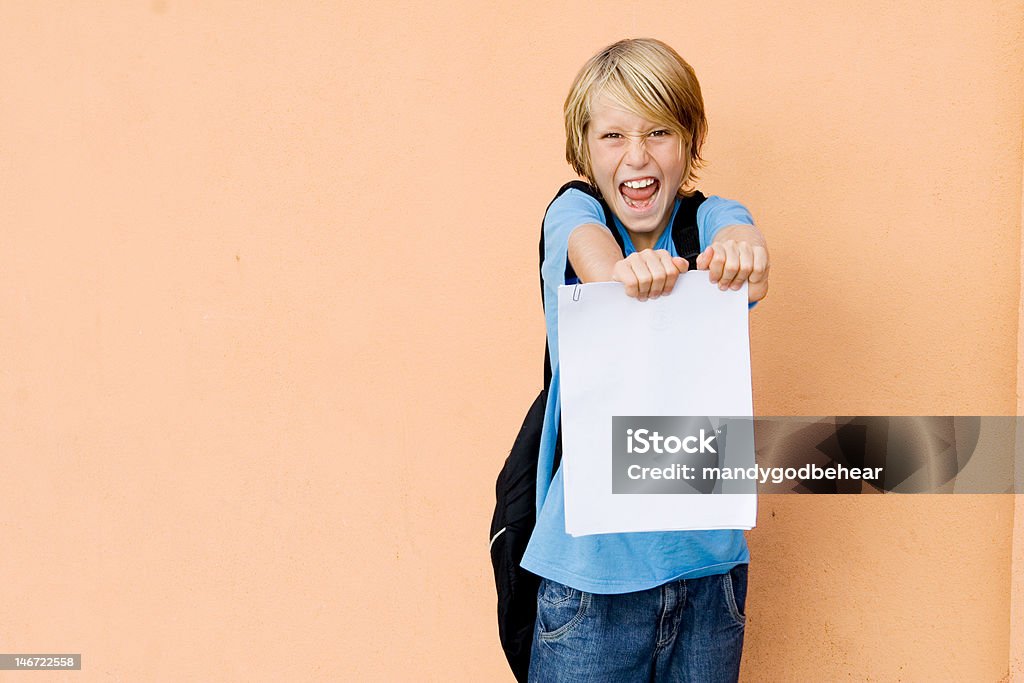 happy child with good exam results happy child showing off good exam results or good news Advice Stock Photo