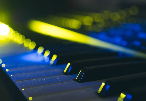 Detailed view of some keys of an electronic keyboard with special light effects