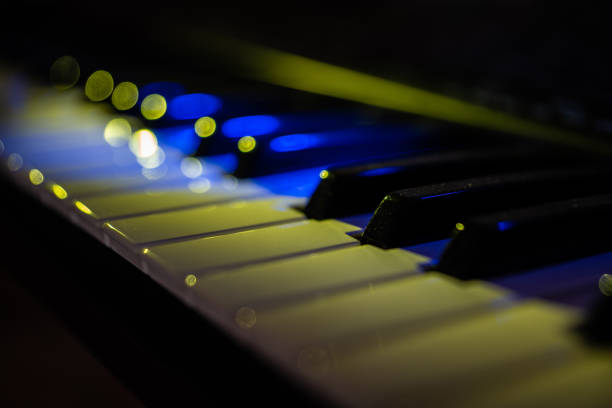 Detailed view of some keys of an electronic keyboard with special light effects