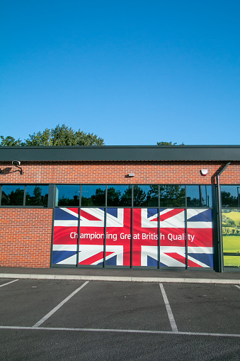 Aldi Supermarket on Otford Road in Sevenoaks at Kent, England, with a banner saying it champions British quality.