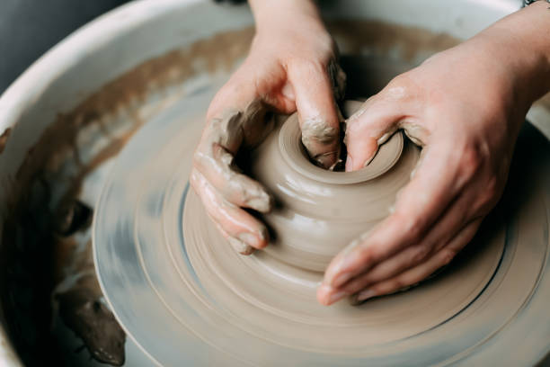 istock Close up of hands working on potter's wheel 1467230834
