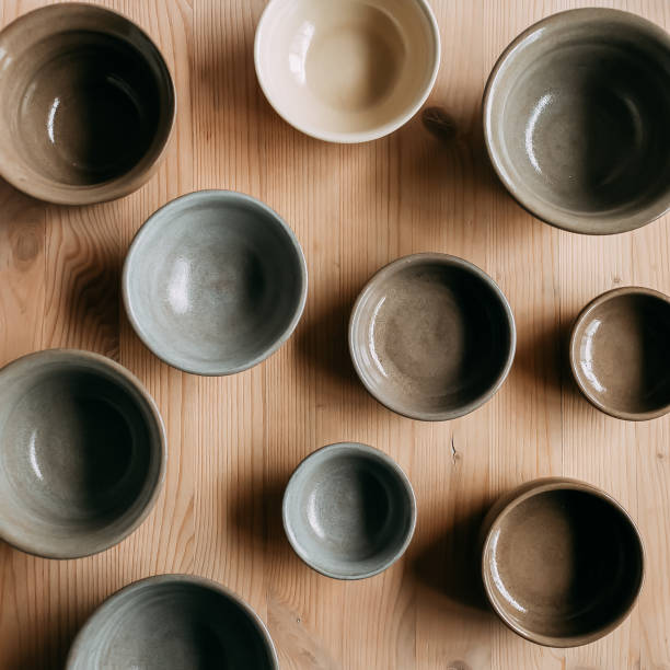 istock Top view of ceramic bowls on wooden background 1467230893