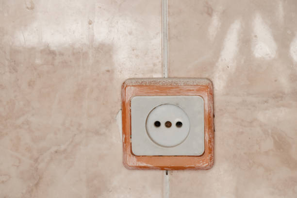 istock white plastic socket on the wall on the tiles in the kitchen 1467231528