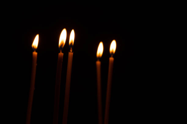 istock church long tapers burn in the dark close up 1467231701