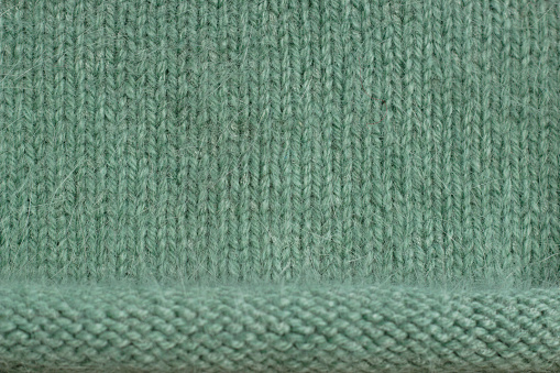 close up of green knitted wool texture