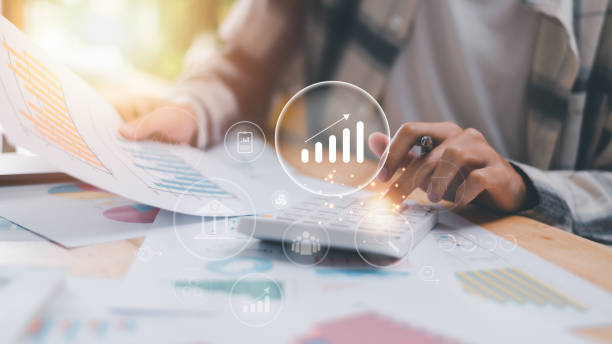 istock Accountant calculating numbers in company financial documents with calculator, Analysis of company financial data, Planning to assess and review the budget, concept of finance and investment 1467235542