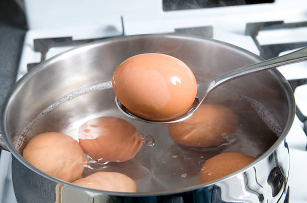 Hard boiled Eggs Cooking Eggs boiling stock pictures, royalty-free photos & images