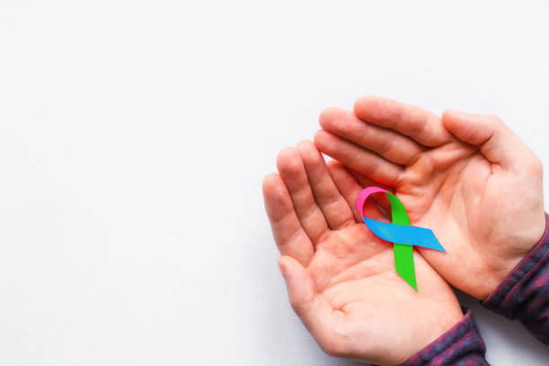 man holding a symbol of World AIDS Day man holding a symbol of World AIDS Day endangered species stock pictures, royalty-free photos & images