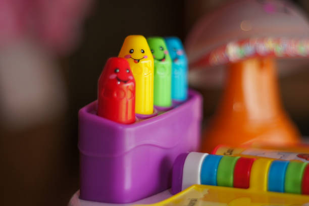 Colorful toy for children. Showing crayons in different colors.