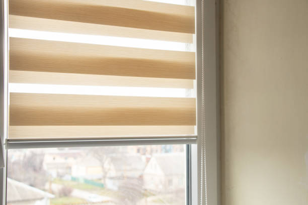 istock beige blinds day night on the kitchen window close-up 1467239582