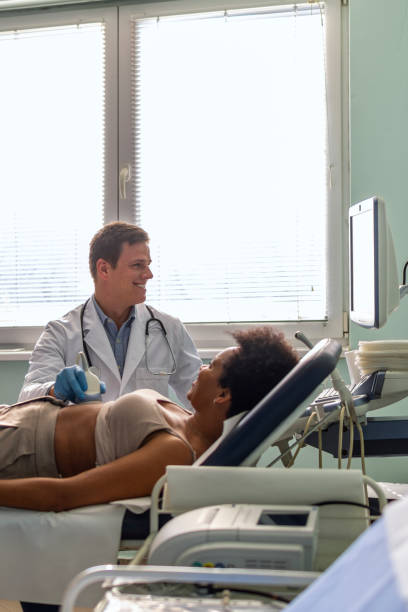 istock Woman getting a sonogram at the hospital 1467241000