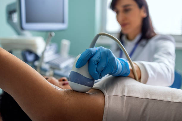 istock Unrecognizable female doctor using ultrasound on woman. 1467241208