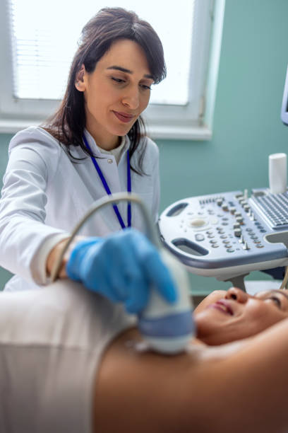 istock Doctor checking woman during sonography examination 1467241210