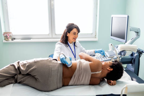 istock Doctor checking woman back during sonography procedure 1467241245