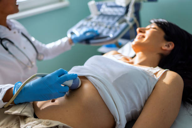 istock Young woman having 4D ultrasound scan. 1467241369