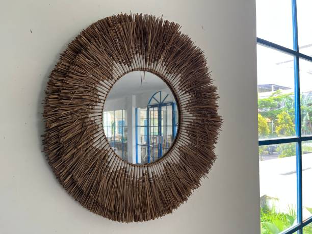 istock Round mirror and rattan frame on the wall 1467245001