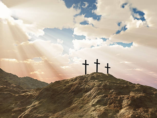 istock Three crosses on a hill with sun beams photo montage 146724748