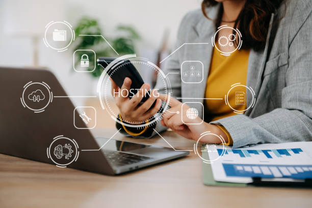 istock Web hosting concept, woman using computer, tablet and presses his finger on the virtual screen inscription Hosting on desk, Internet, business, digital technology concept. 1467247740