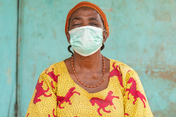 istock Old african woman wearing a face mask 1467248875