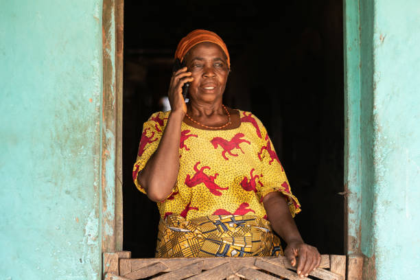 istock Smiling elderly African woman making a phone call 1467248901