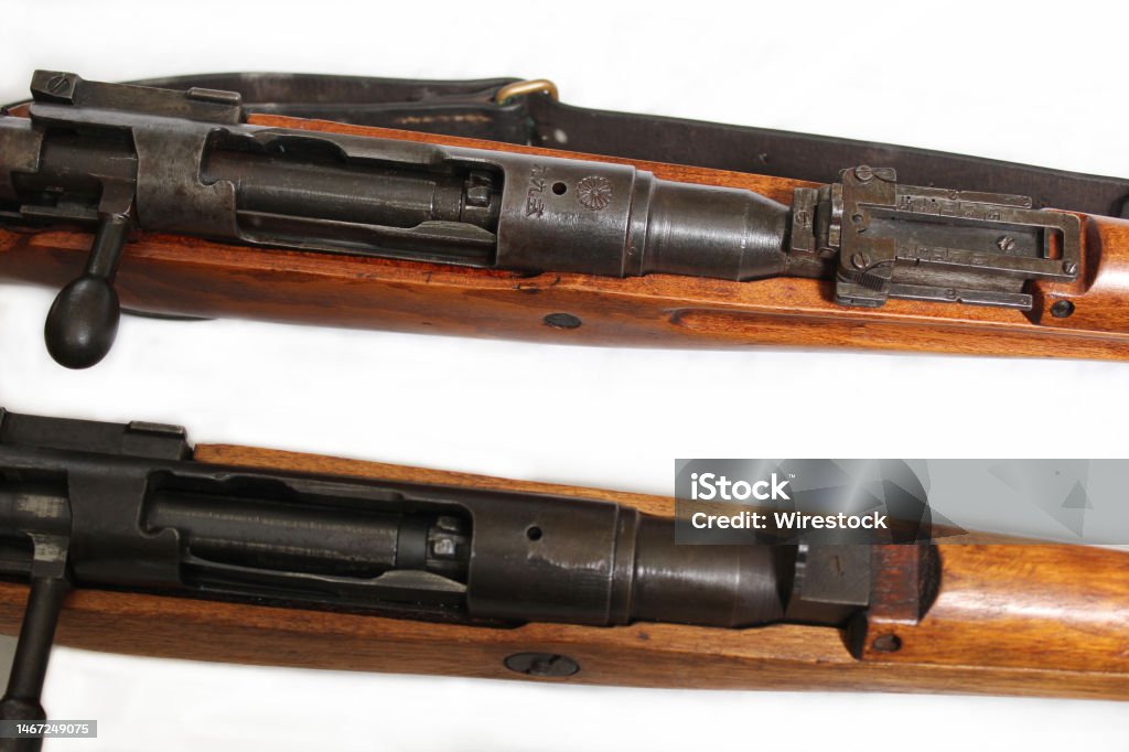 Close-up shot of two versions of Japanese arisaka rifles from WW2 A close-up shot of two versions of Japanese arisaka rifles from WW2 Hunting - Sport Stock Photo
