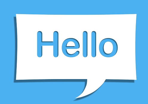 An illustration of a white paper speech bubble with the word hello on it isolated on blue background