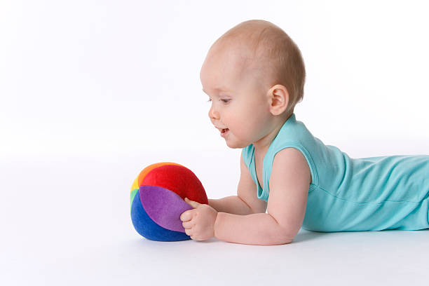 istock toddler with a colored ball 146725048