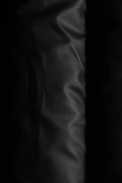 background of a black puffer jacket close up
