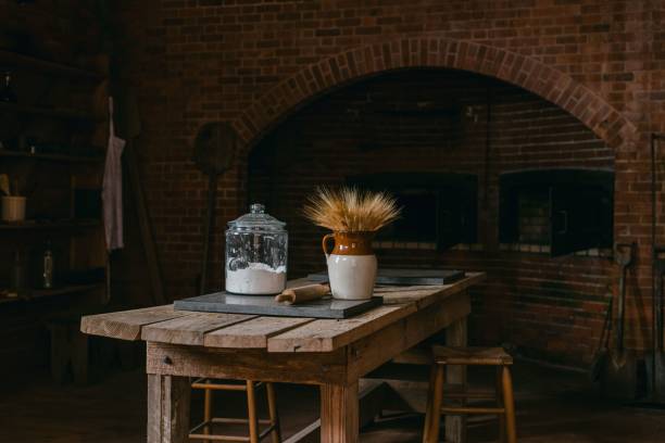 istock Jar and a glass container laid on an old wooden table in a kitchen 1467252360