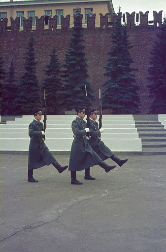 Moscow, Russia, Soviet Union, 1978. Members of the Red Army Honor Guard march through Red Square in Moscow. In the background the Kremlin wall.