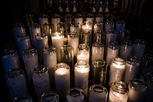 White candles in glass candle holders, Montreal Notre-Dame Basilica, Canada