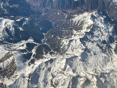 An aerial view of the snow capped Pyrenees mountains on the border of Catalonia, Spain, and France.