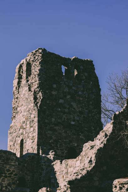istock Old ruined tower facade in the blue sky background 1467255131