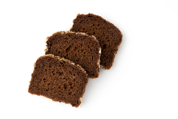 istock slices of rye bread on white background, top view 1467255680