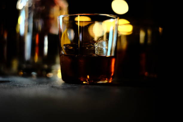 istock Glass of drink on dark background 1467258363