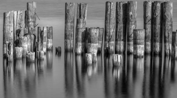 istock Grayscale long exposure shot of an old pier 1467259131