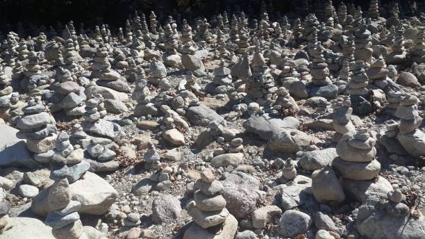 istock stone towers lined up on the rocks 1467259387