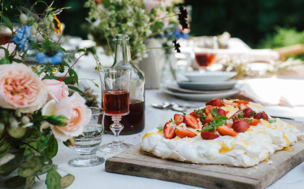 istock Decorated table with strawberry cake outdoors 1467261078