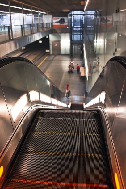 istock Vertical shot of escalator going to subway station 1467261354