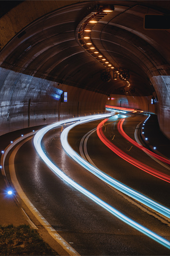 A long exposure of car light trails in a tunnel